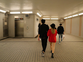 people walking in a pedestrian subway in Tsim Sha Tsui