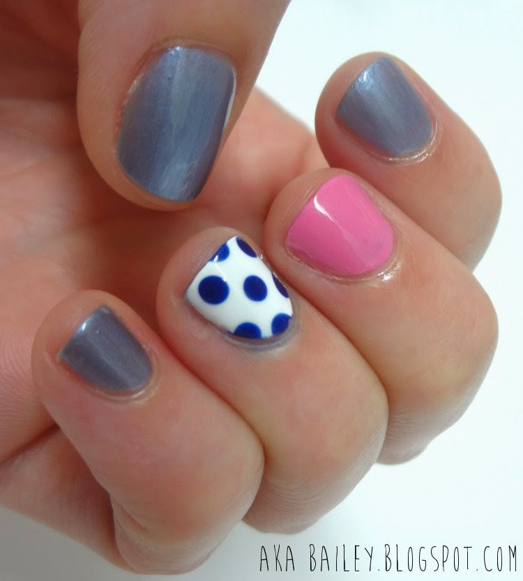 Blue nails with pink and polka dot accent nails