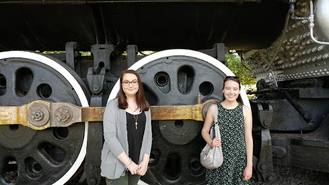 daughters in front of steam train wheels Nashville TN.