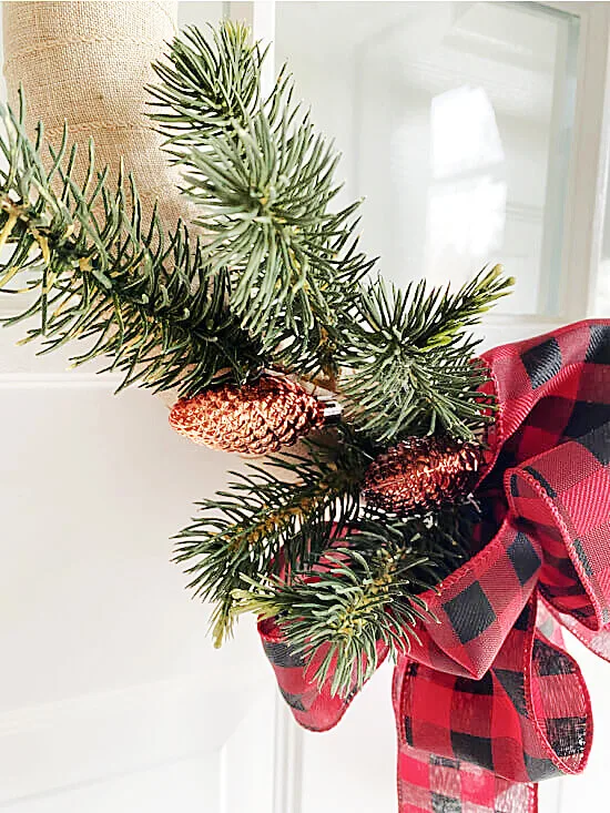 greens and ornaments attached to wreath