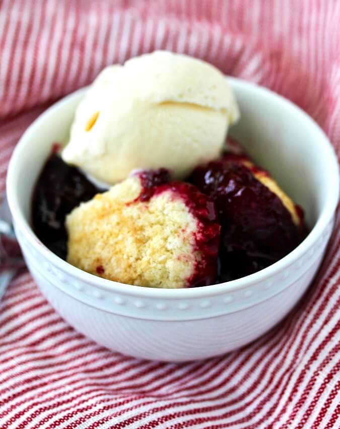 Blackberry Cobbler with ice cream and biscuits