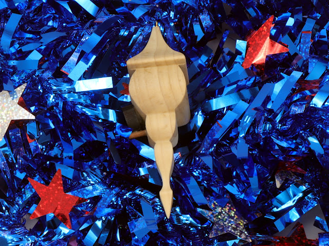 Handmade Wood Miniature Birdhouse Christmas Tree Ornament on Blue Garland Side View
