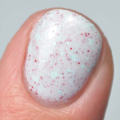 white nail polish with glitter close up swatch