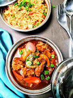 Chilli chicken gravy serving with fried rice, fork spoon in background