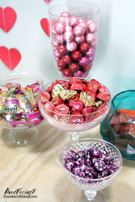 Pedestal containers, vases and jars filled with yummy candy for Galentine's day. Candy Buffet's are a must at any party!