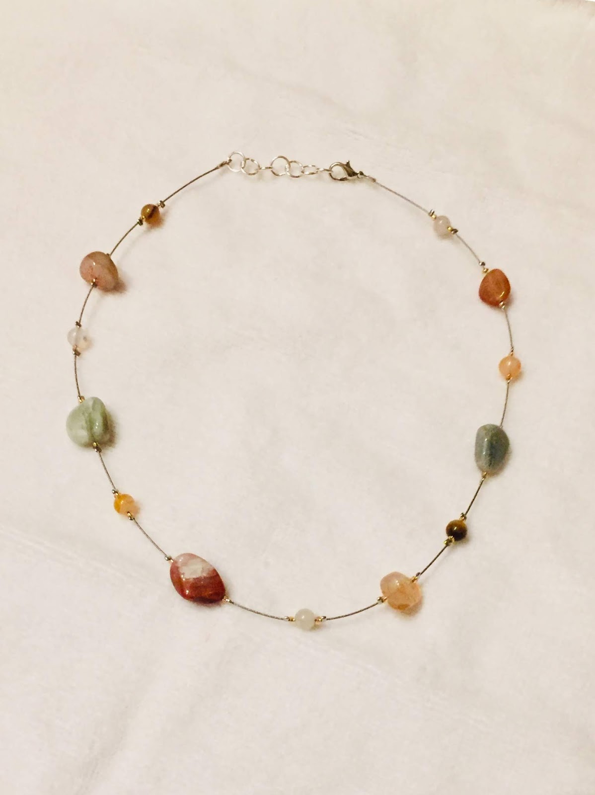 Floating bead necklace with natural stone beads