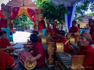 Traditional Balinese Group Of Men Playing Balinese Music Instrument In The Balinese Wedding Ceremony, Patemon Village, Buleleng Regency, Bali, Indonesia 
