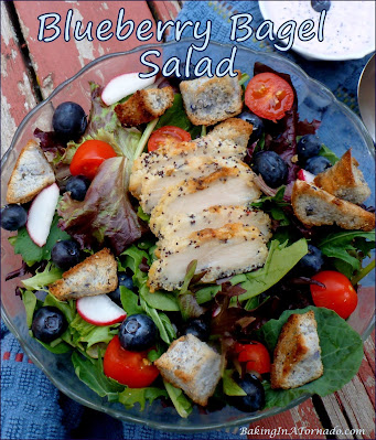 Blueberry Bagel Salad: mixed Greens, blueberries, and blueberry bagel croutons, topped with chicken and drizzled with creamy blueberry Greek yogurt dressing. | Recipe developed by www.BakingInATornado.com | #recipe #salad