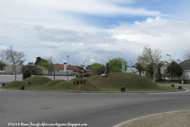 green, hilly roundabout