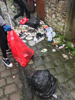 domestic rubbish in an alleyway