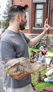 Justin holding Lucky the snapping turtle