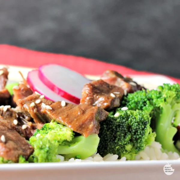 Slow Cooker Beef and Broccoli | by Renee's Kitchen Adventures sitting on white plate close up