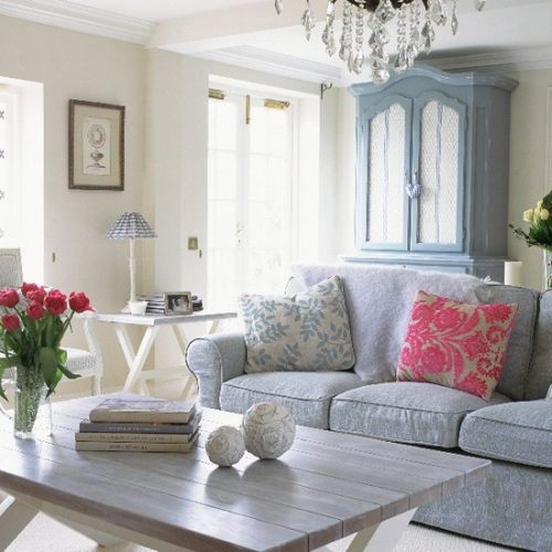 lovely light blue and grey living room with pink accents