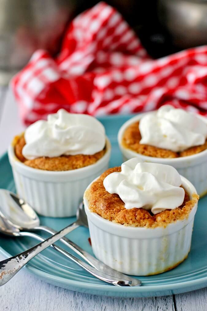 Mini Peach Cobblers topped with whipped cream