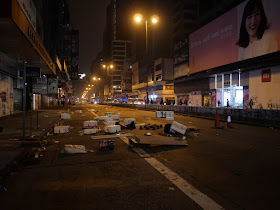 debris set by protestors to block Nathan Road