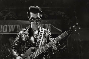 Link Wray black and white photo with leather jacket nd guitar