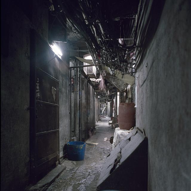 A typical dark alley in the walled city