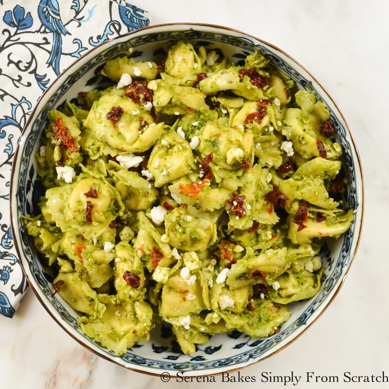 Tortellini Pesto Pasta Salad with Feta and Sun-Dried Tomatoes is a favorite Pasta Salad for a easy lunch, dinner or side dish from Serena Bakes Simply From Scratch.