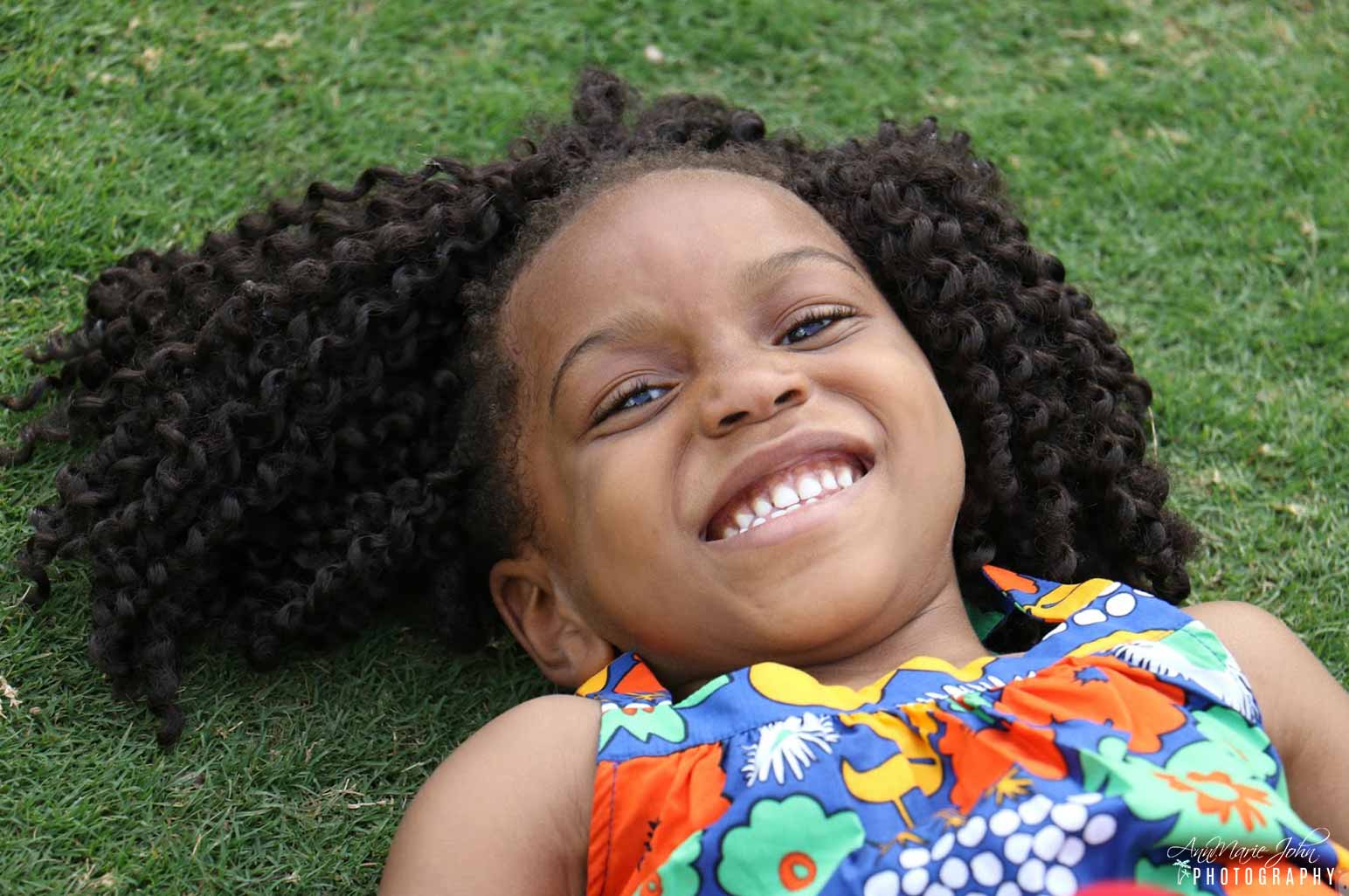 Child Laying in the Grass