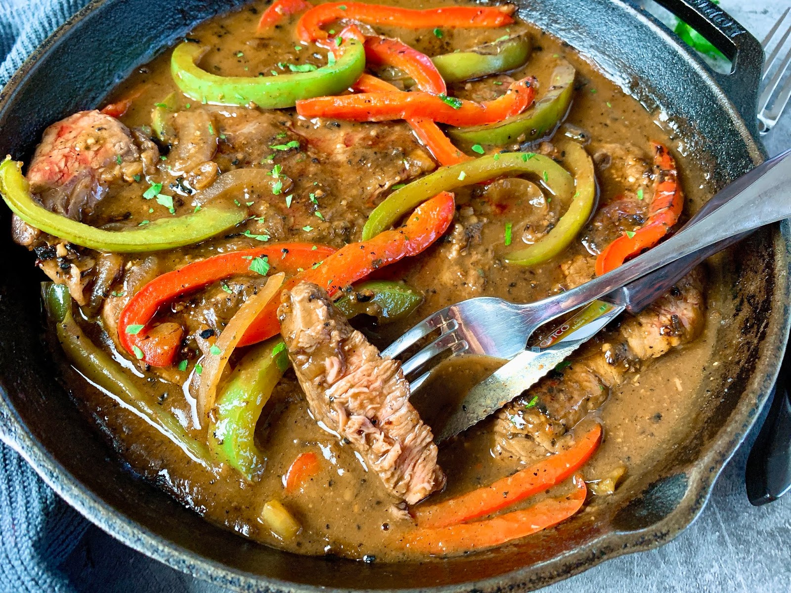 Smothered Steak with Onions and Peppers