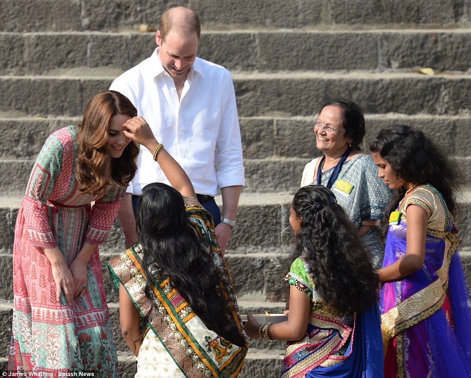 Princess William & Kate are met by Indian women at a temple