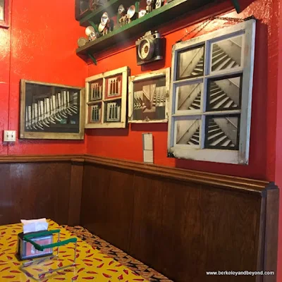 work of artist Suzy Kuhr hangs in her Smart Pizza parlor in Guerneville, California