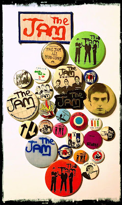 An array of badges featuring The Jam and Paul Weller