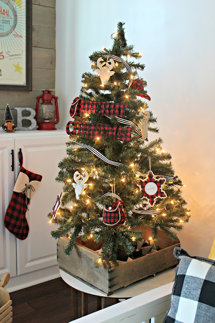 trimmed the trees with all kinds of plaid  and wooden goodies