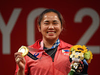 Hidilyn Diaz wins Philippines' first Olympic gold medal for weightlifting.