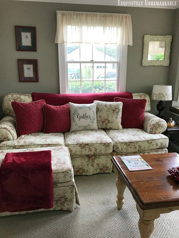 Cottage Style Floral Couch in a green family room.