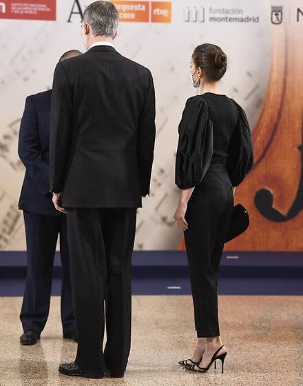 Queen Letizia wore a new black puff-sleeve taffeta knit top and trousers from Manuel Pertegaz