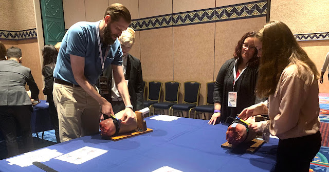USU's Dr. Craig Goolsby demonstrates how to use a tourniquet for high school students at a 2019 conference in Orlando, Florida.