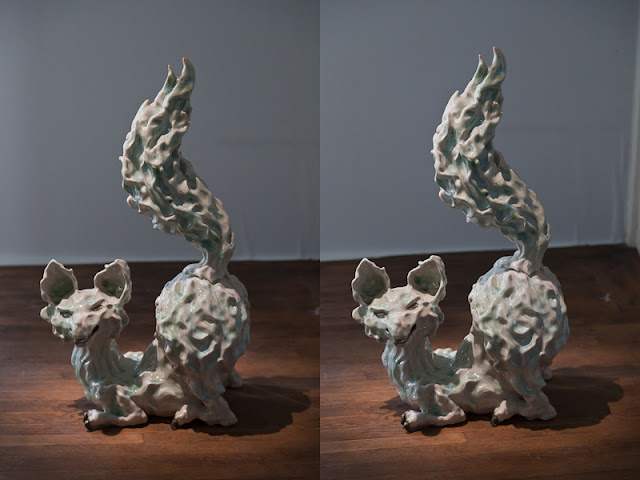 A stereoscopic image of a fox made out of ceramics