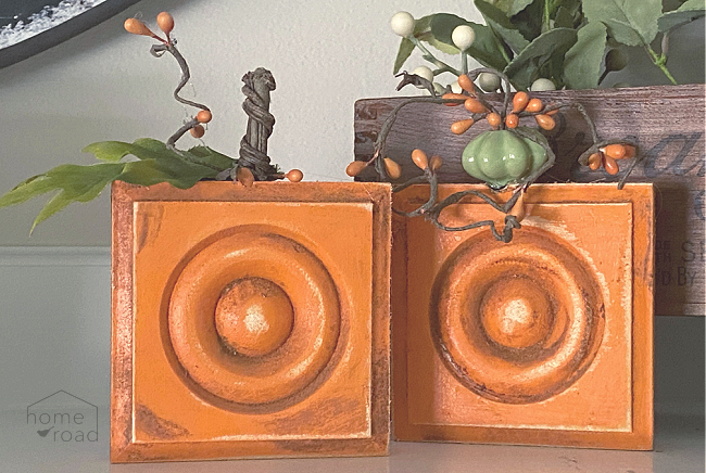 two pumpkins distressed with cinnamon