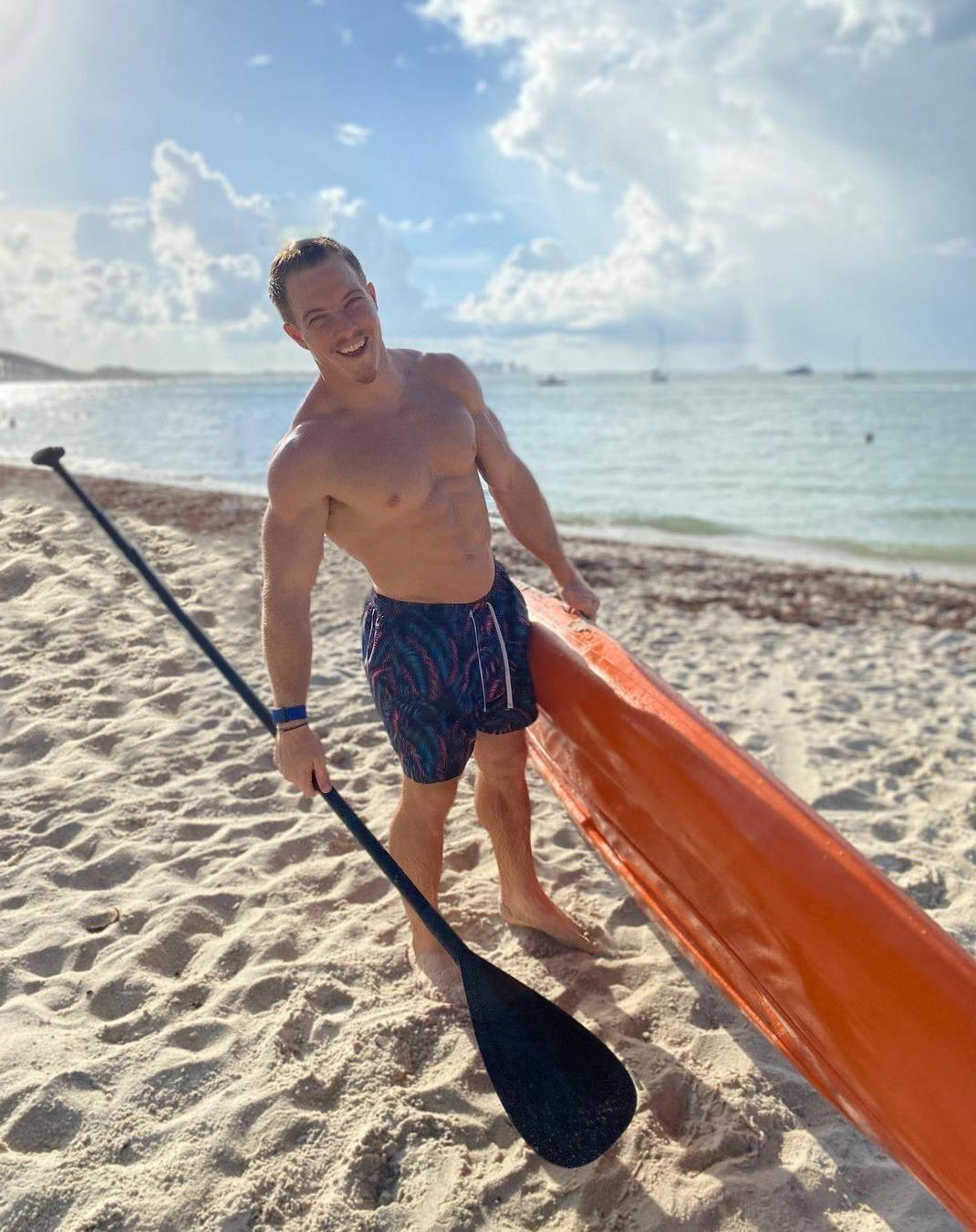 hot-shirtless-surfer-dude-canoing-noah-ohlsen-fit-beach-hunk-smiling.jpg