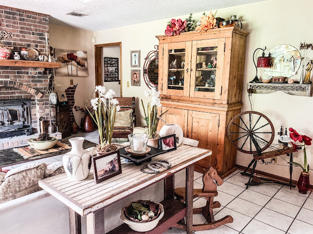 rustic neutral living room with pops of red