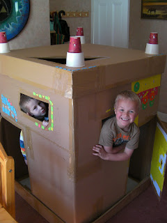 giant cardboard box used as childrens playhouse