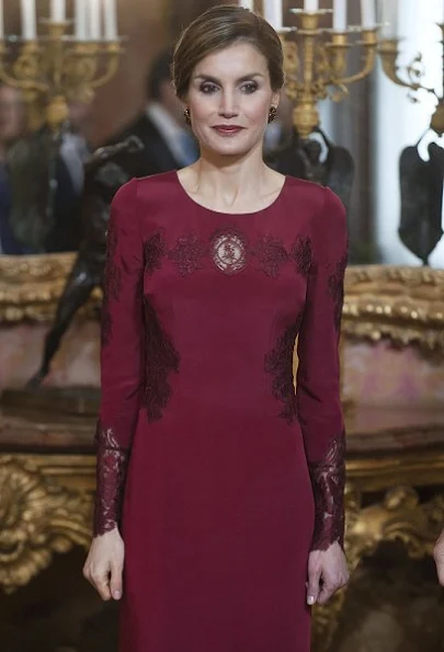 Queen Letizia attends the annual Foreign Ambassadors reception at the Royal Palace. Queen Letizia wore Felipe Varela Long sleeve dress in red diamond earrings