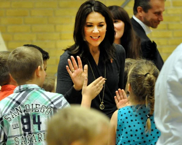 Crown Princess Mary wore Prada dress, Gianvito Rossi dress, coat, Gold diamond earrings, Prada trousers, new winter trend dress