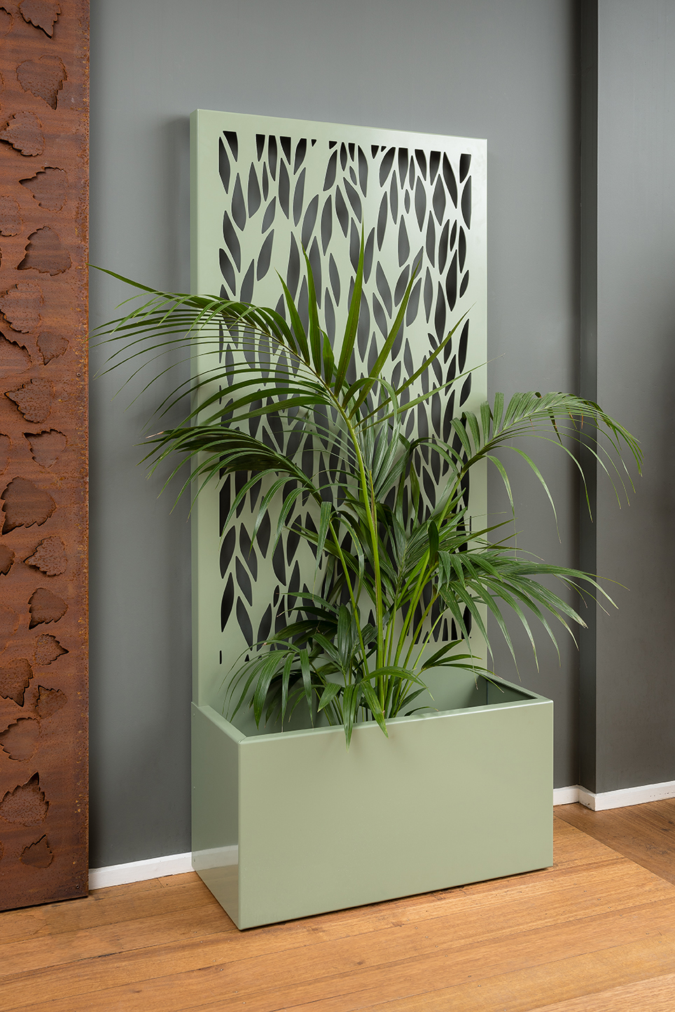 A freestanding screen offering privacy and a generous planter for your