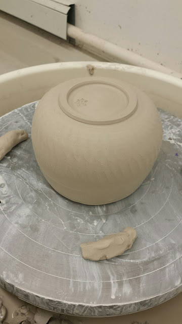 Ceramic vessel with subtle chattering by the trimming tool, in progress.