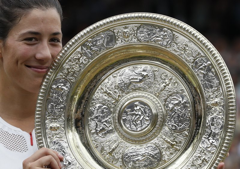 Garbine Muguruza Wins her first title at Wimbledon, beating a fading Venus Williams 7-5, 6-0 Spain’s Garbine Muguruza holds the trophy after defeating Venus Williams of the United States in the Women’s Singles final match on day twelve at the Wimbledon Tennis Championships in London Saturday, July 15, 2017. (AP Photo/