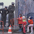 West German school children pause to talk with two East German border guards beside an opening in the Berlin Wall during the collapse of communism in East Germany, November 1989. (Picture)