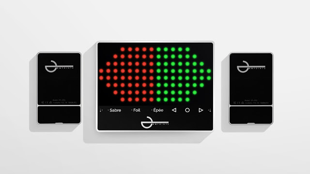 EnPointe Display Box system shot against white background. The system is the scoring box, shown with its panels of red and green LEDs lit to indicate a double touch, flanked by the two pocket relay boxes. All boxes are black, with white text and the white EnPointe logo.