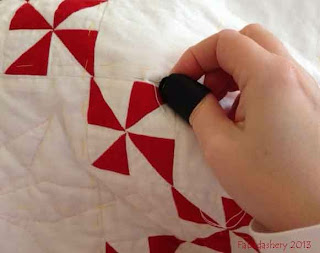 Hand Quilting Red and White Pinwheel Quilt