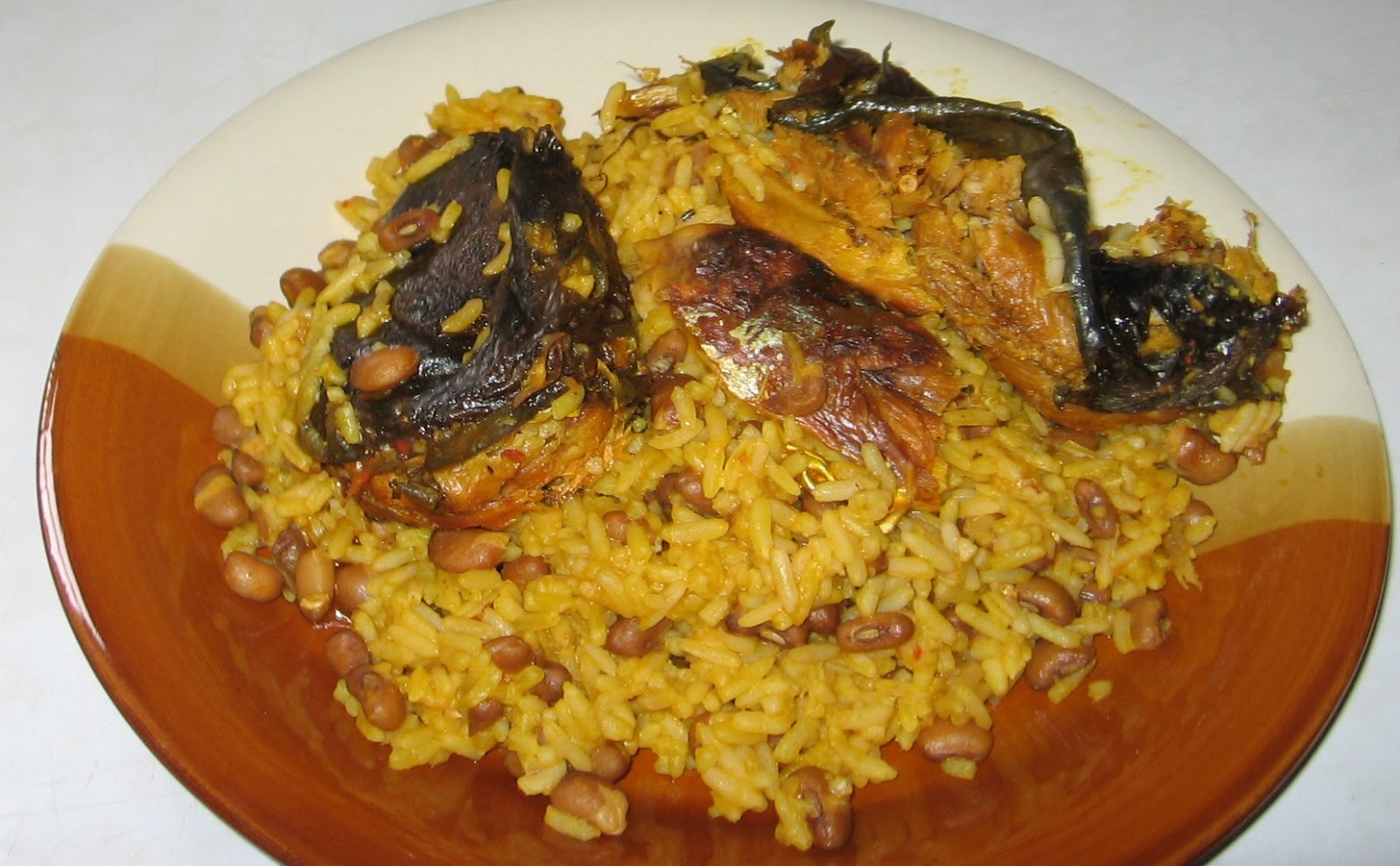 Nigerian Palm Oil Rice And Beans With Fish