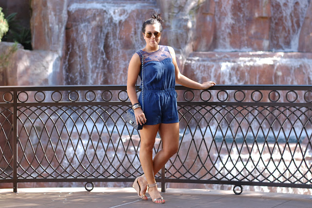 Blue silk romper, Chanel caviar mini handbag, Sam Edelman Serena Sandals and Alexis Bittar bangles.