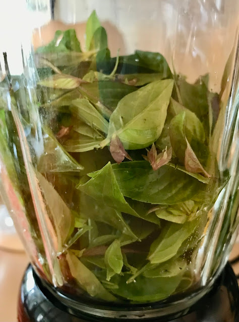 Thai basil leaves in a blender.