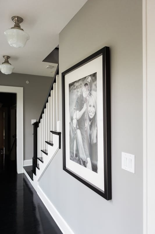 Hallway with large framed photograph on grey wall on Hello Lovely Studio