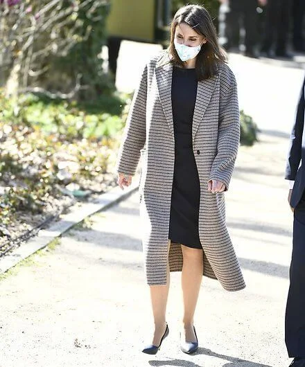 Queen Letizia wore a double breasted wool blend coat from Carolina Herrera. Isabel Diaz Ayuso